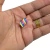 Aplique emborrachado em formato de marshmallow, com cores azul, rosa, amarelo e verde