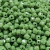 Quadrados passantes leitosos na cor verde, medindo 8x8mm, empilhados em uma superfície.