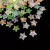 Conjunto de pedrarias em forma de estrela colorida, em diversos tons