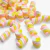 Aplique emborrachado em formato de marshmallow, com cores rosa, amarelo e branco, ideal para artesanato.