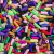 Misturinha Colors Tube 100g com diversas pedrarias coloridas em formato tubular.