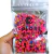 Pacote de pedrarias coloridas Misturinha Colorful Cube 100g, mostrando uma variedade de cubos em várias cores.