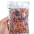 Misturinha Matte Balloon Colors 100g, contendo pedrarias coloridas em tons variados.