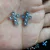 Cruz falso strass azul