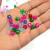 Miçangas sextavadas coloridas com diversas cores como rosa, verde, azul e transparente.