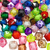 Mistura de pedrarias coloridas em formato de cubo de 10x10mm, com diversas cores e miolos visíveis.