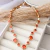 Colar Riviera Zircônias Laranja Aperol Banhado a Ouro 18k