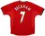 Camisa retrô do Manchester United, versão 2000/2002, com o nome "BECKHAM" e o número "7" nas costas.