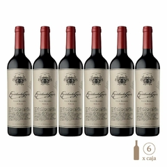 Seis botellas de vino tinto Escorihuela Gascón Gran Reserva Syrah, con etiquetas elegantes y detalles en dorado.