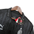 Camisa AC Milan 4 23/24 PUMA masculina na cor preta, com detalhes em relevo e etiquetas de marca.