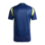  "Camisa reserva do Nashville SC, temporada 2025, cor azul marinho com detalhes em amarelo, vista traseira."