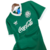 Camisa verde titular do Palmeiras de 1989, feita pela Adidas, com logotipo da Coca-Cola e detalhes em branco.