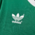 Logo da Adidas em uma camisa verde retro do Palmeiras de 1989.
