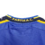 Detalhe da parte de trás da camisa Parma Calcio 2001, com a etiqueta "PARMA A.C." em amarelo.