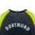 Detalhe da Manga Preta com Punho Listrado em Amarelo e Branco da Camisa Borussia Dortmund Retrô 1995 Nike Preto 