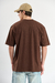 Remera oversize University Orso Bianco en jersey algodón peinado con estampa, disponible en chocolate, crudo y verde