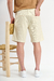 Bermuda china "Modry" confeccionada en gabardina apta, con botón personalizado y etiqueta de cuero, disponible en verde, manteca y amarillo