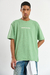 Remera oversize Streetwear en verde, confeccionada en jersey de algodón peinado con estampa en delantero y espalda. Disponible en talles S a XXL
