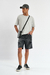 Bermuda jean mom color negro, con roturas y diseño en denim rígido, ideal para un look urbano