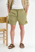 Short de baño liso "Crushed", confeccionado en nylon bomber, con bordado a contratono y cordones jaspeados, disponible en verde, gris, mostaza y negro.