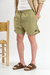 Short de baño liso "Crushed", confeccionado en nylon bomber, con bordado a contratono y cordones jaspeados, disponible en verde, gris, mostaza y negro.
