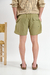 Short de baño liso "Crushed", confeccionado en nylon bomber, con bordado a contratono y cordones jaspeados, disponible en verde, gris, mostaza y negro.