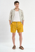 Short de baño liso "Crushed", confeccionado en nylon bomber, con bordado a contratono y cordones jaspeados, disponible en verde, gris, mostaza y negro.