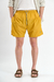 Short de baño liso "Crushed", confeccionado en nylon bomber, con bordado a contratono y cordones jaspeados, disponible en verde, gris, mostaza y negro.