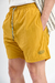 Short de baño liso "Crushed", confeccionado en nylon bomber, con bordado a contratono y cordones jaspeados, disponible en verde, gris, mostaza y negro.