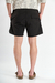 Short de baño liso "Crushed", confeccionado en nylon bomber, con bordado a contratono y cordones jaspeados, disponible en verde, gris, mostaza y negro.