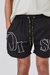 Short de baño clásico de Orso Bianco, diseño con estampa frontal y cordones resistentes.