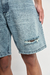 Bermuda jean mom Lennon Orso Bianco, celeste, denim rígido, tajo lateral, roturas, piludos en ruedo, talles S al XXL
