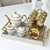 Conjunto 6 Xícaras de Porcelana c/ Pires p/ Café 90ml e Suporte Versa Branco e Dourado - Dona Fulô Decor