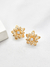 Brinco Flor Vazada com Zircônia Folheado em Ouro 18K