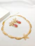 Conjunto Alto Luxo Folhas Vazado com Brincos de Pedra Folheado em ouro 18K na internet