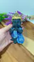 ESTATUETA BUDA INFANTIL EM RESINA AZUL E DOURADA na internet
