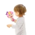 Criança segurando um brinquedo interativo em forma de espelho, sorrindo ao se ver refletida.