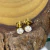 Brinco Aço PVD Gold Zircônia 5mm - comprar online