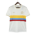 Camisa masculina branca da Seleção da Colômbia, edição especial de 100 anos, com listras coloridas nas cores da bandeira.