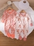 PIJAMA ENTERITO DE FLORES ROSADAOY NARANJA