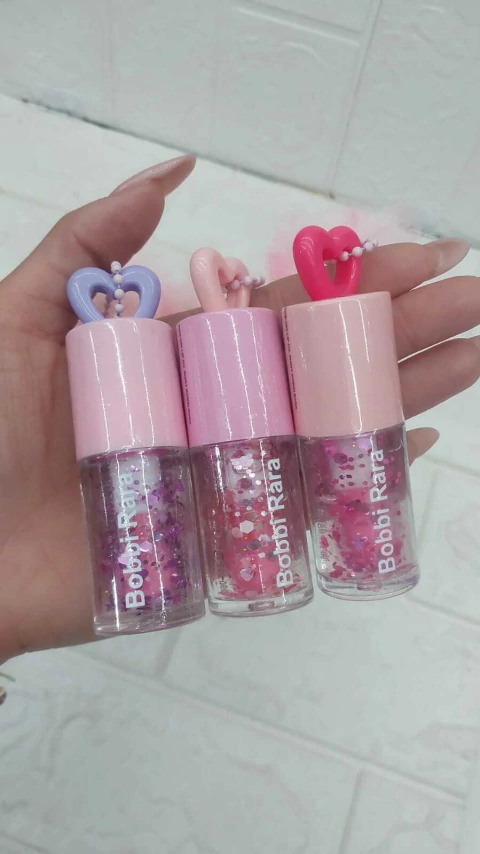 LIP OIL -BOBBI RARA COM POMPOM