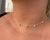 Choker ponto de luz rosa