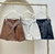 SHORTS SAIA EM COURO PU COM CINTO BOHO BABI