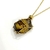 RELICARIO DE ACERO RED OJO DE TIGRE DORADO - tienda online