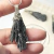 DIJE DE ALPACA ESCOBA DE BRUJA Y PIRITA - comprar online