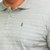GOLA POLO LISTRADA COM BOLSO VERDE na internet