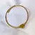 Bracelete de aço inox/ banho dourado, regulável, Aro Torcido e Coração