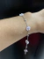 Pulseira Bolinha Inox Flor Cristal na internet