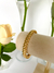 Bracelete Rígido Design Croissant Banhado a ouro 18k