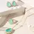 Brinco Gota com Turmalina verde e Zircônias Brancas banhado a ouro 18k - Moda Lu Portella | Acessórios Sofisticados | Semijoias de Luxo 